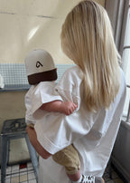 Kids cap with embroidery, structured front and adjustable velcro strap for ages 2 to 6. Designed to match the adult collection