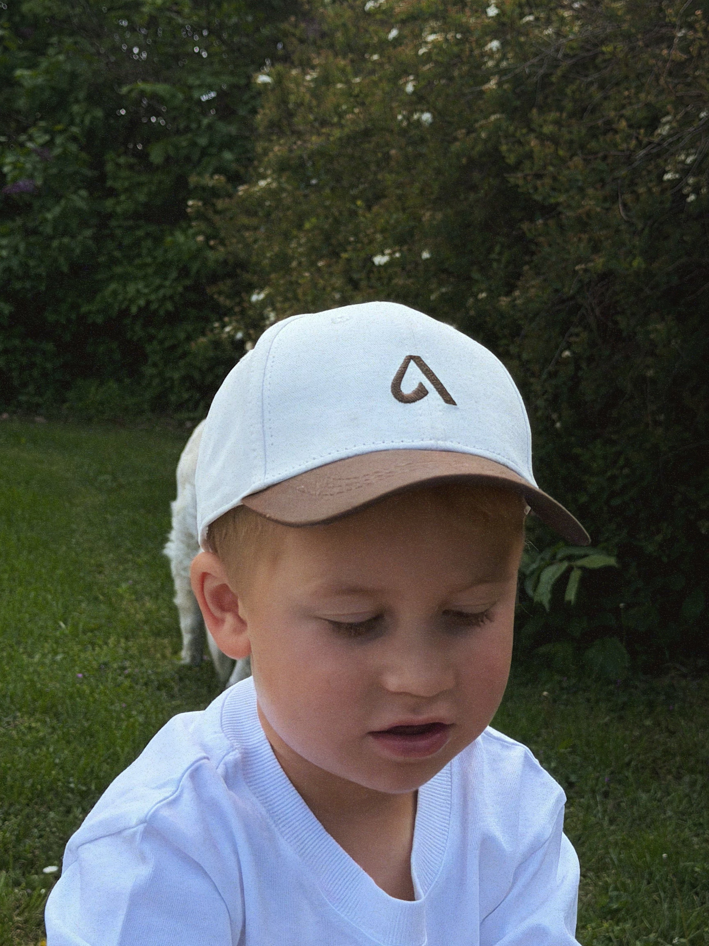 Kids cap with embroidery, structured front and adjustable velcro strap for ages 2 to 12. Designed to match the adult collection